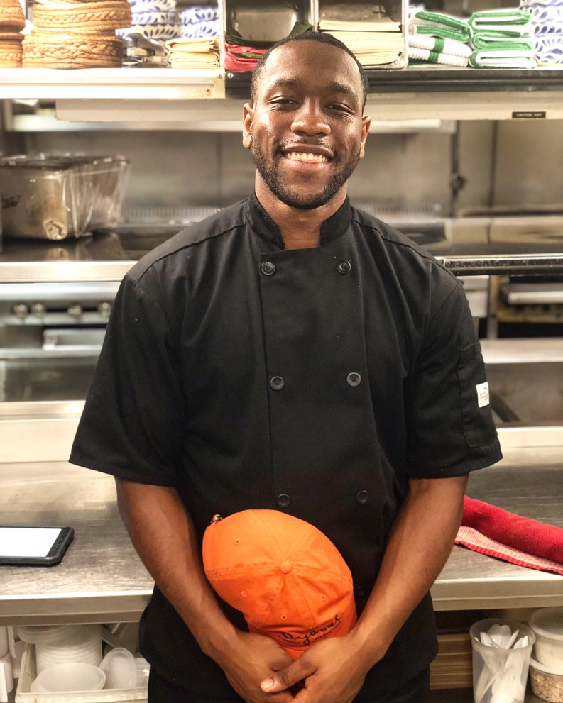 Professional cook in kitchen